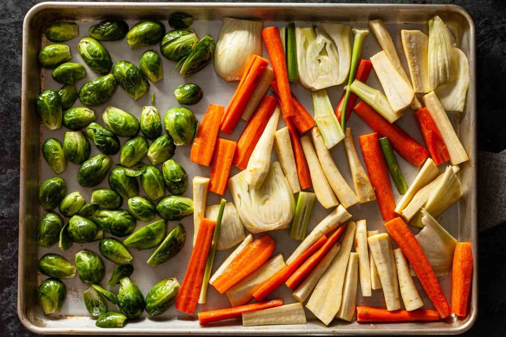 Bowl of Roast Vegetables Salad with nuts and feta