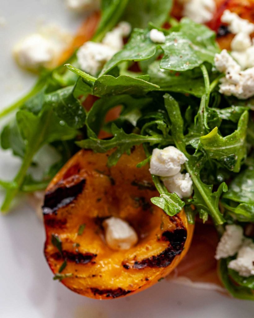 Grilled peach and prosciutto salad