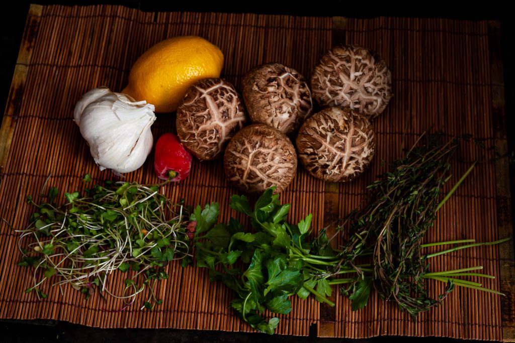 shitake mushroom bruschetta ingredients: lemon, garlic, chili, shitake, microgreens, parsley, thyme