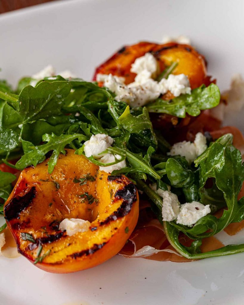 Grilled peach and prosciutto salad