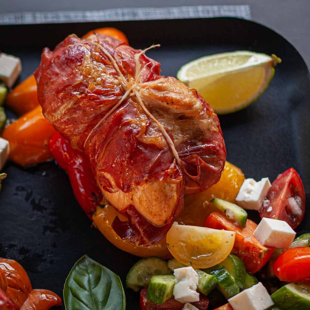 Prosciutto-Wrapped Chicken Breasts with Smoked Bell Peppers and Greek Salad
