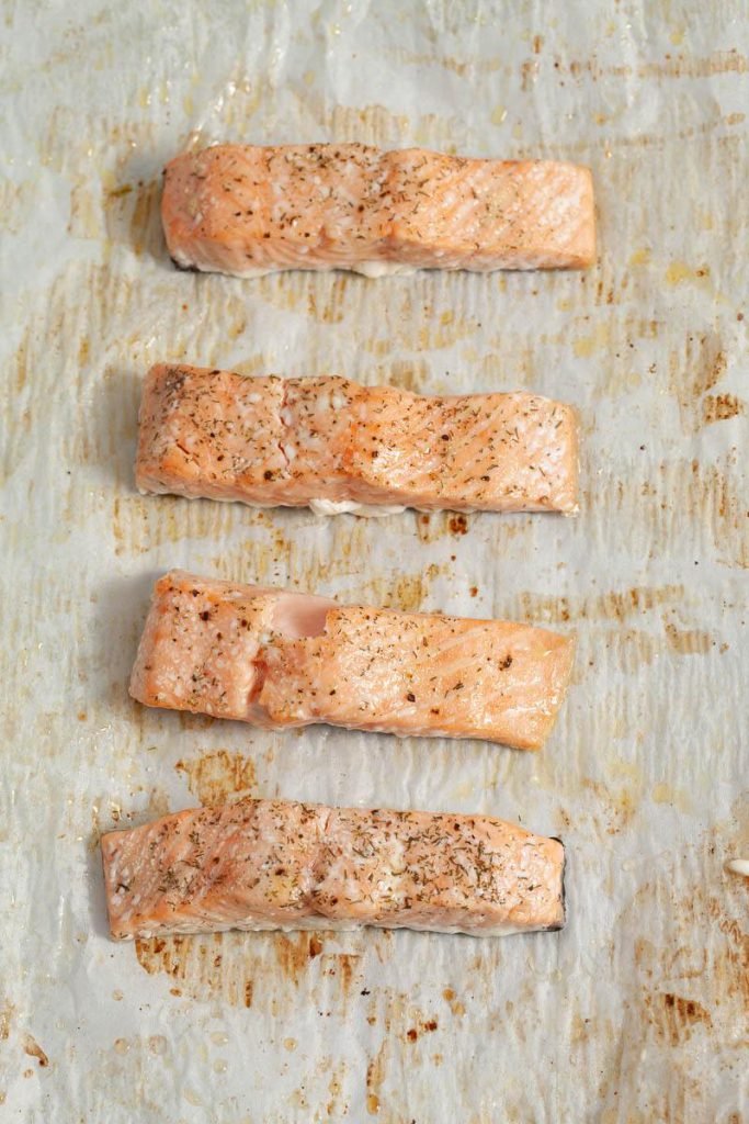 Roasted salmon on baking sheet